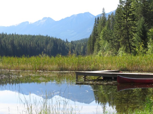 Glassy Lake With Canoe Mountain Lake